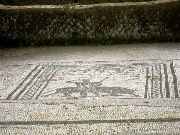 Mosaic of a Hunter and Wild Animal in Ostia Antica. 