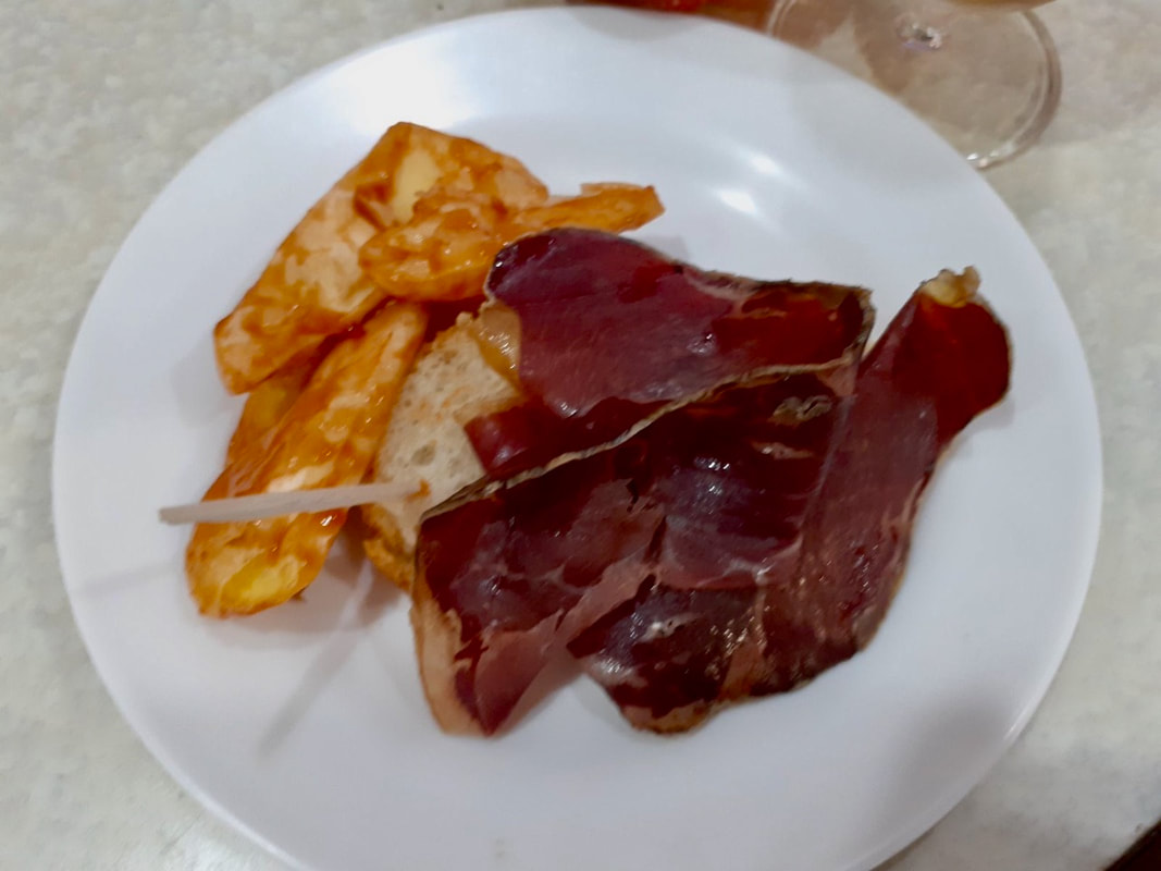 A plate of Cecina with beer